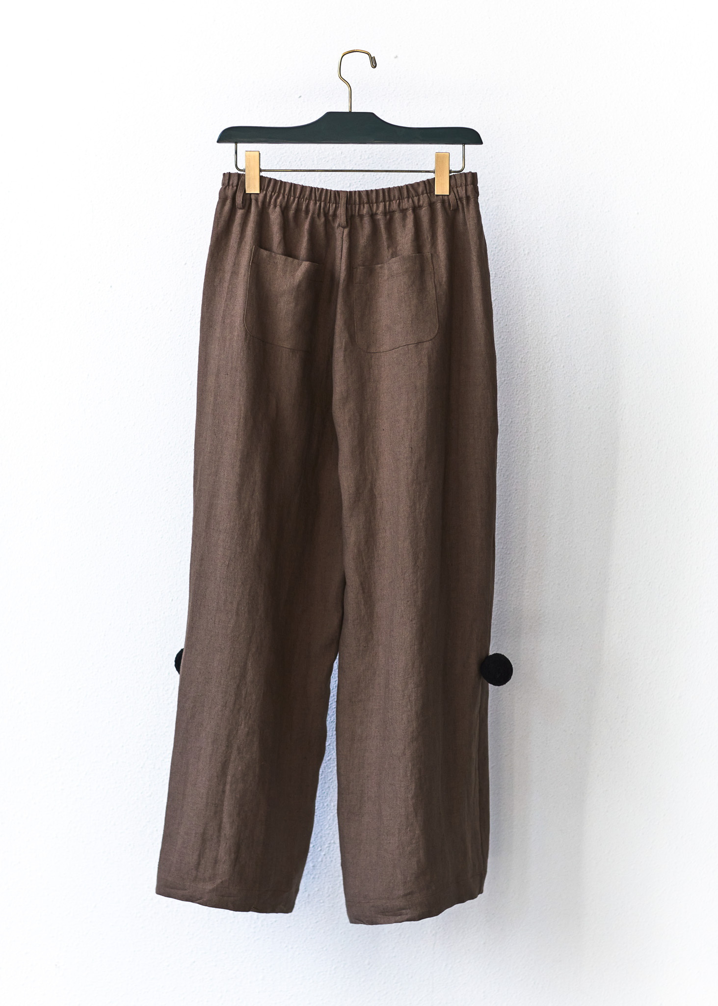 Between Acts FW26 POM-POM TROUSERS back view